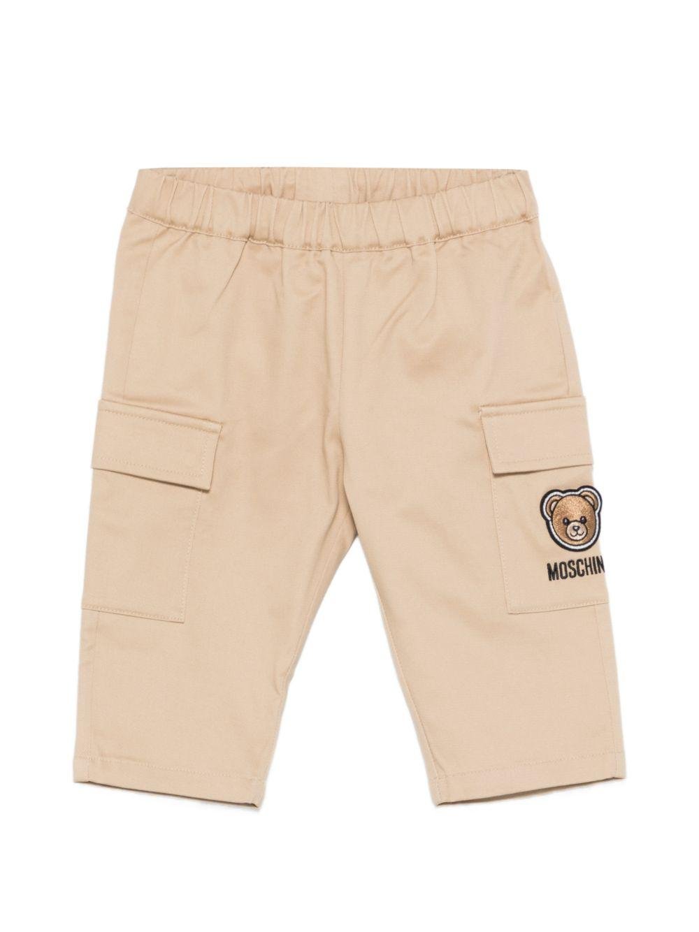 Pantaloni per neonato Moschino Kids beige con ricamo Teddy sul davanti - Rubino Kids