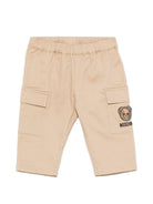 Pantaloni per neonato Moschino Kids beige con ricamo Teddy sul davanti - Rubino Kids