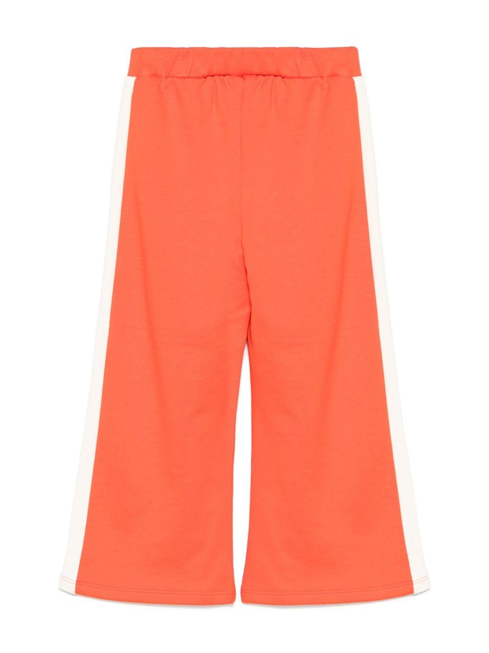 Pantaloni sportivi per bambina Mini Rodini Note rosso con dettaglio laterale a righe - Rubino Kids