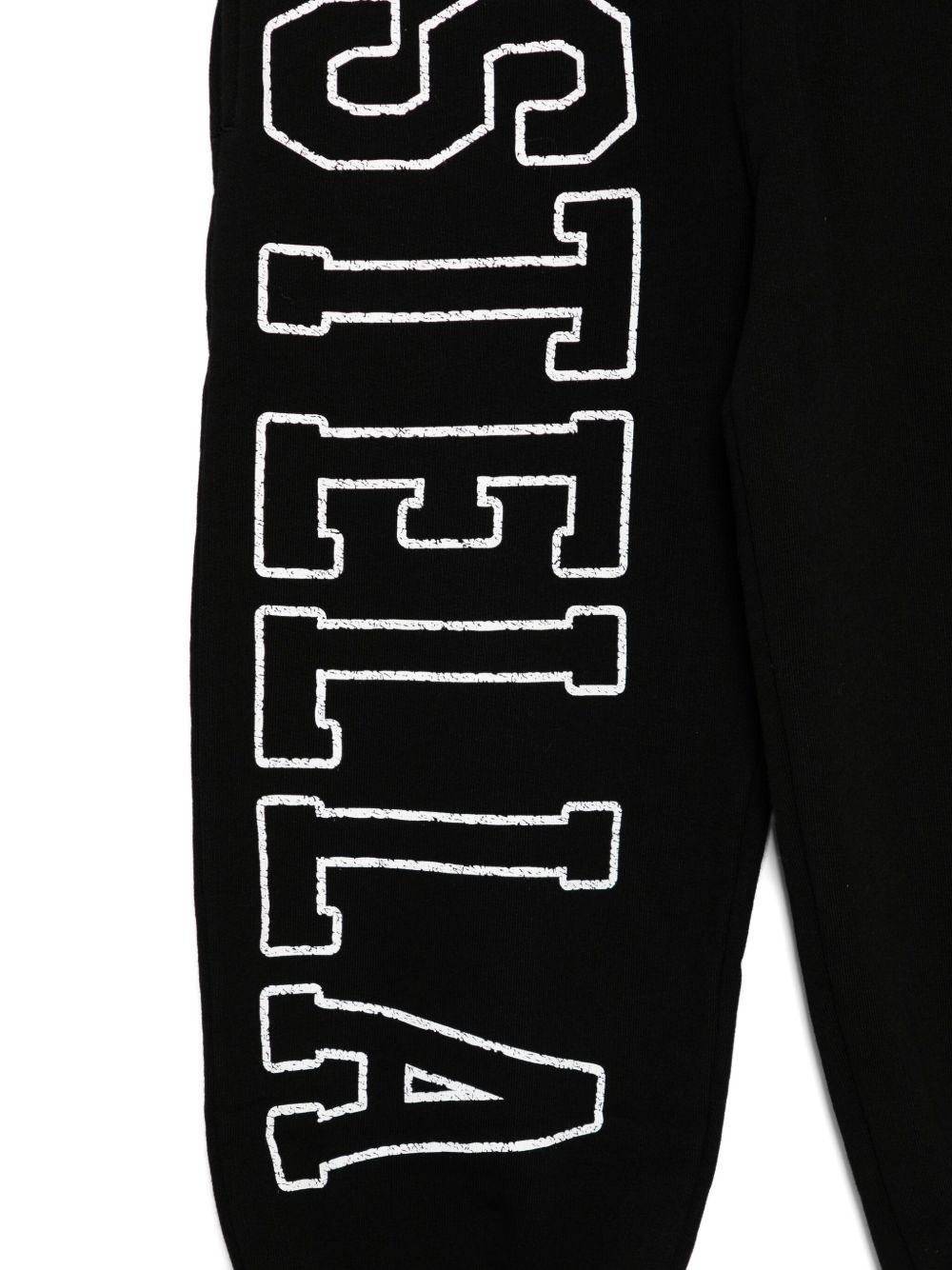 Pantaloni sportivi per bambina Stella McCartney Kids nero con stampa logo sulla gamba - Rubino Kids