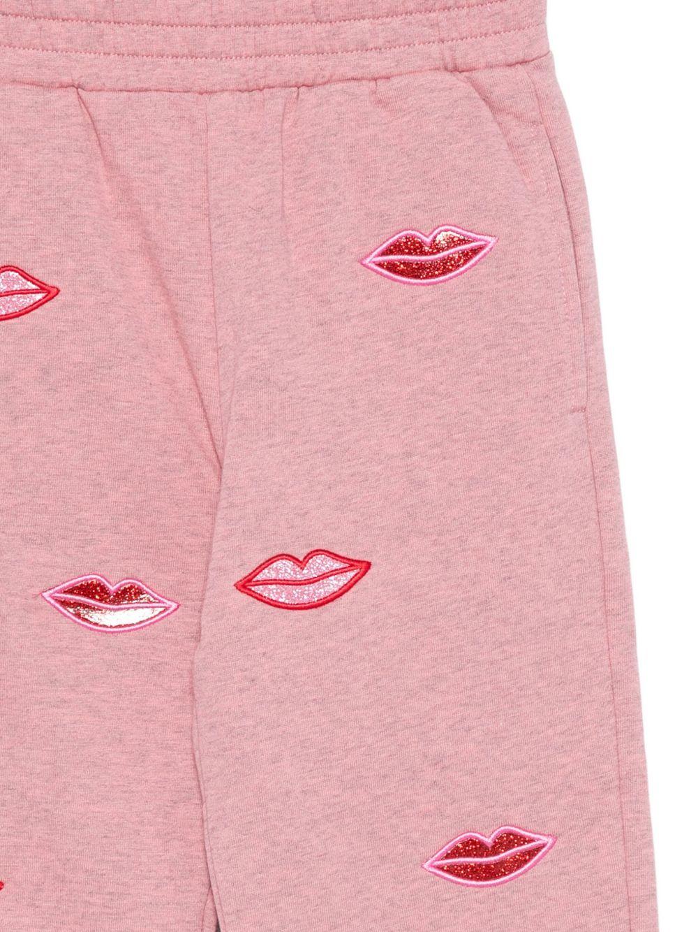 Pantaloni sportivi per bambina Stella McCartney Kids rosa con stampa bacio - Rubino Kids