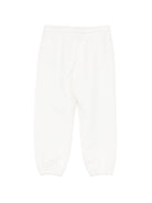 Pantaloni sportivi per bambino Moschino Kids bianchi con logo sul davanti - Rubino Kids