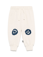 Pantaloni sportivi per neonato Molo Simeon beige con motivo smiley - Rubino Kids