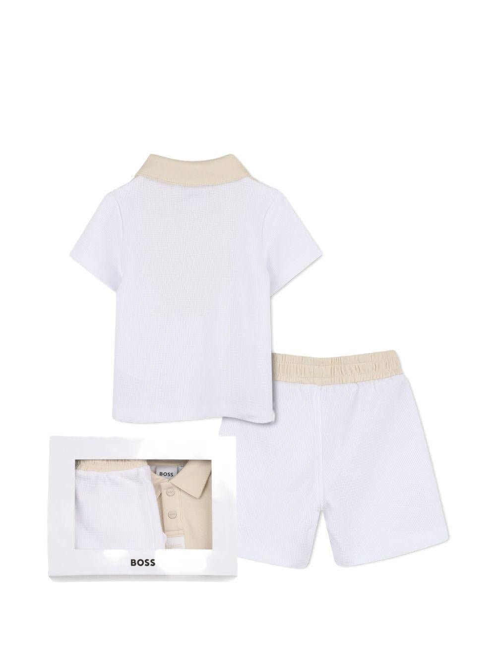 Set polo e shorts per neonato BOSS Kids bianco con logo - Rubino Kids