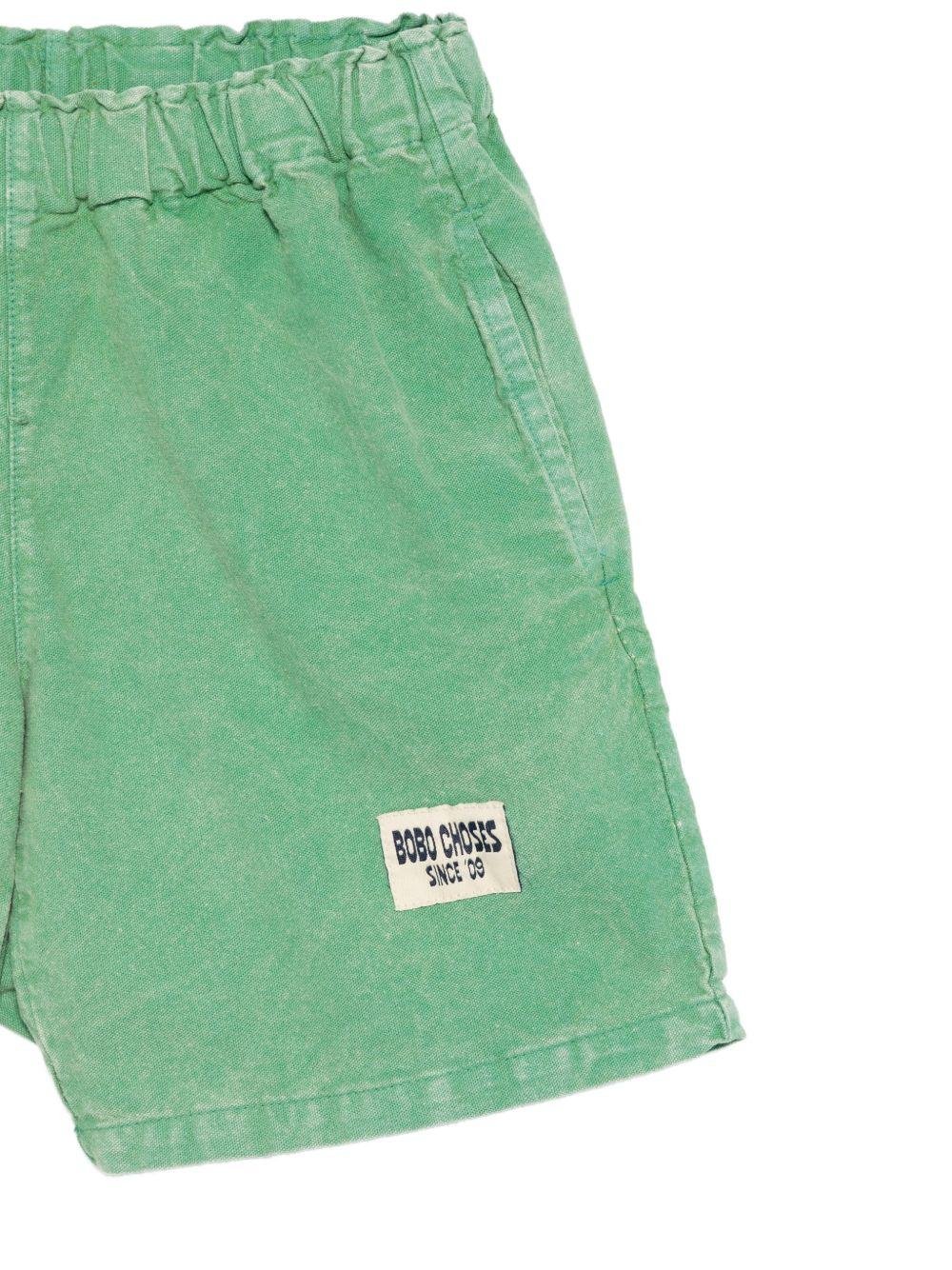 Shorts per bambino Bobo Choses verde con toppa con logo sul davanti - Rubino Kids