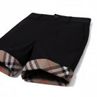 Shorts per bambino Burberry Kids neri con dettagli con motivo Vintage Check - Rubino Kids