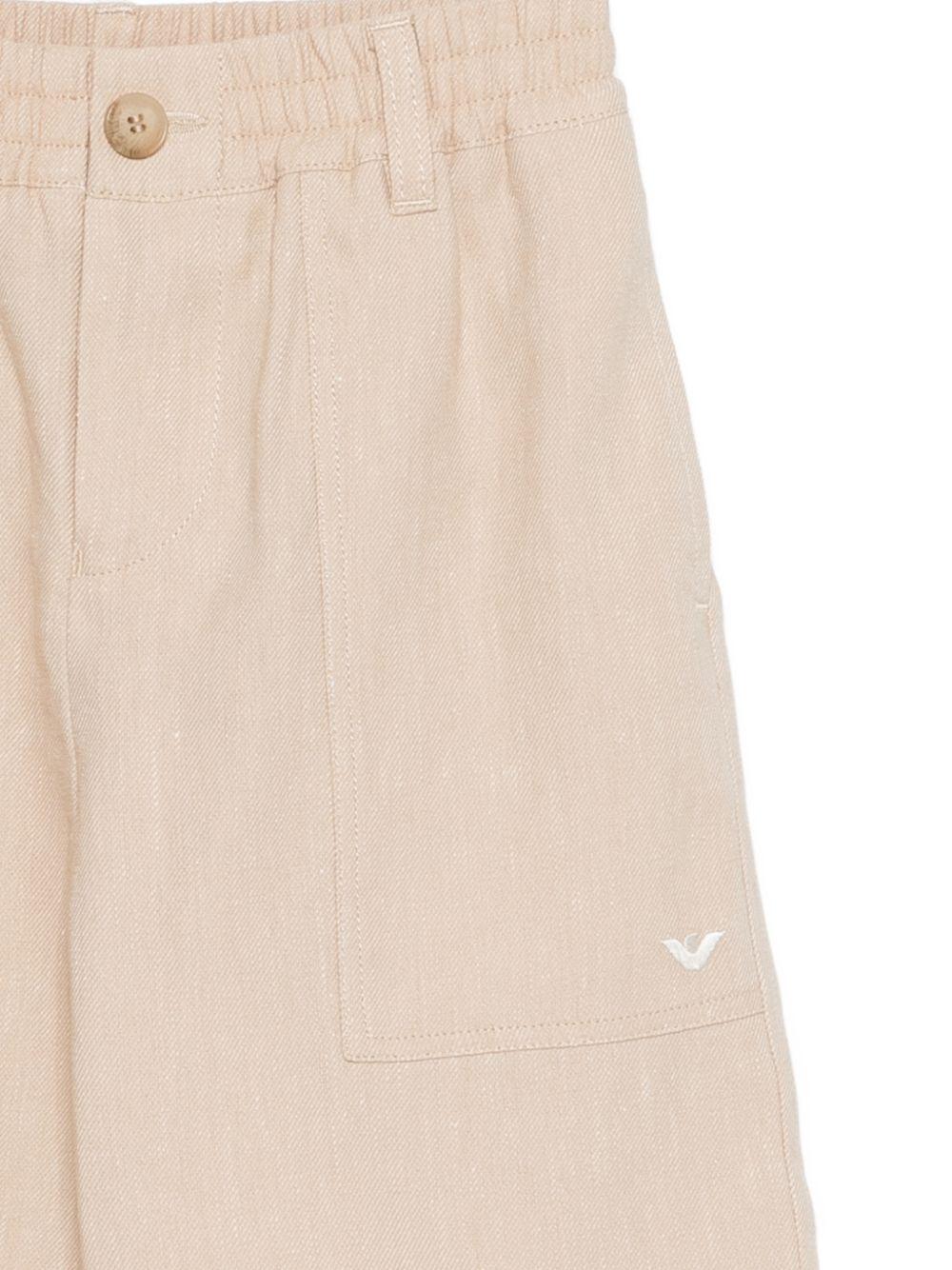 Shorts per bambino Emporio Armani Kids beige con logo aquila sul davanti - Rubino Kids