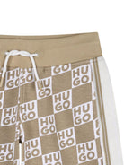 Shorts per bambino Hugo Kids beige con stampa logo all - over - Rubino Kids
