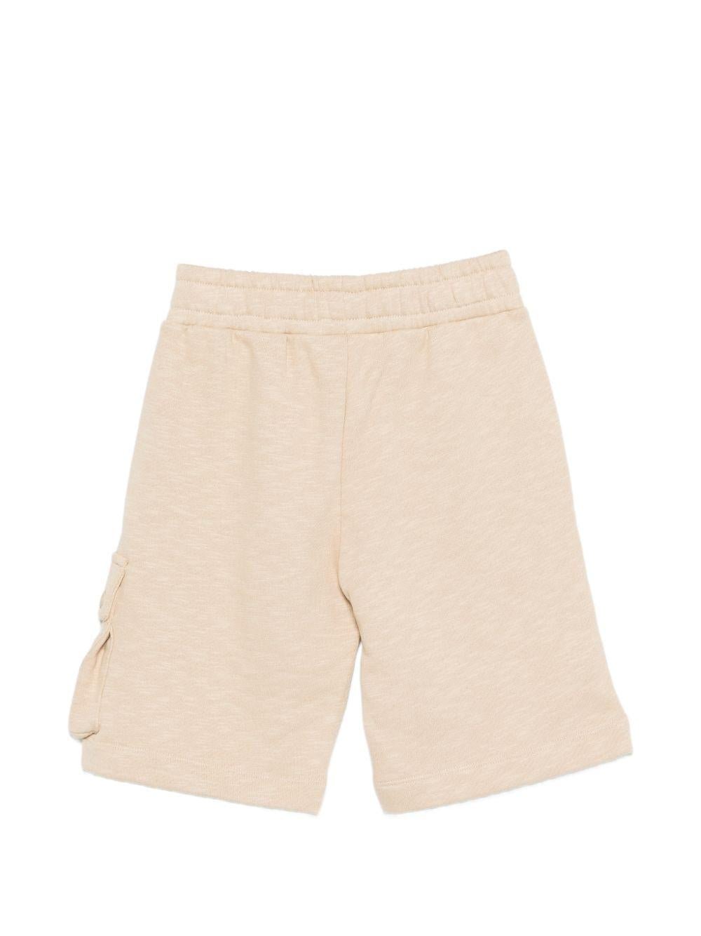 Shorts per bambino Moschino Kids beige con logo sul davanti - Rubino Kids