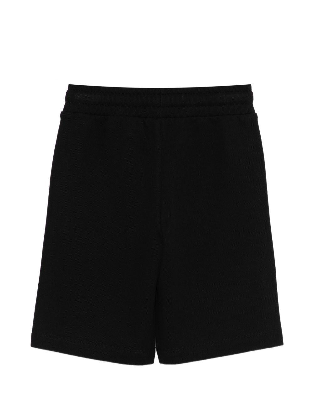Shorts per bambino Moschino Kids neri con logo sul davanti - Rubino Kids
