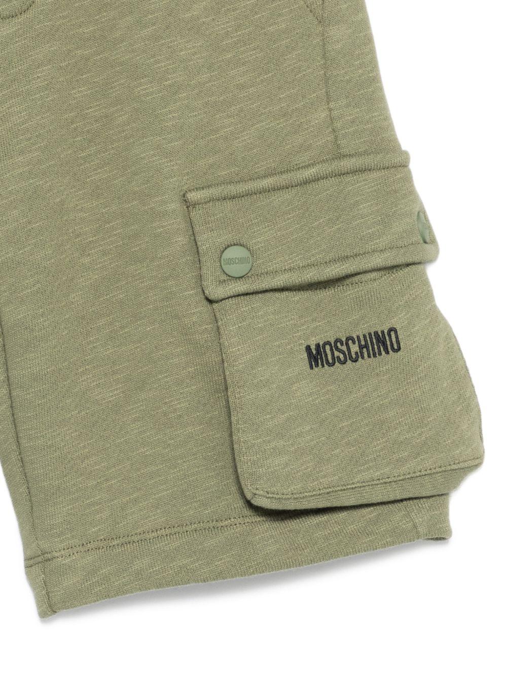 Shorts per bambino Moschino Kids verde con logo sul davanti - Rubino Kids