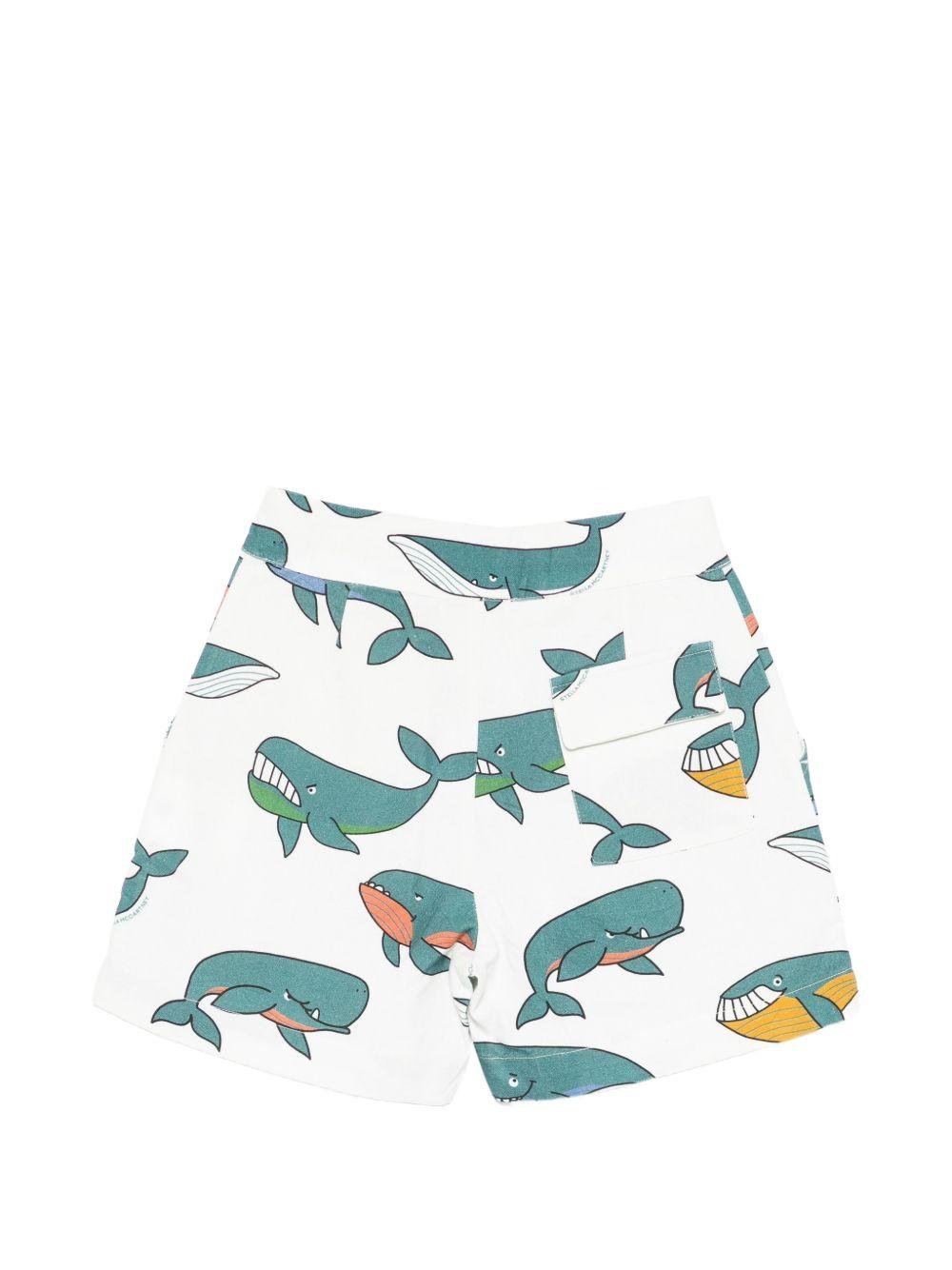 Shorts per bambino Stella McCartney Kids bianchi con stampa balene - Rubino Kids