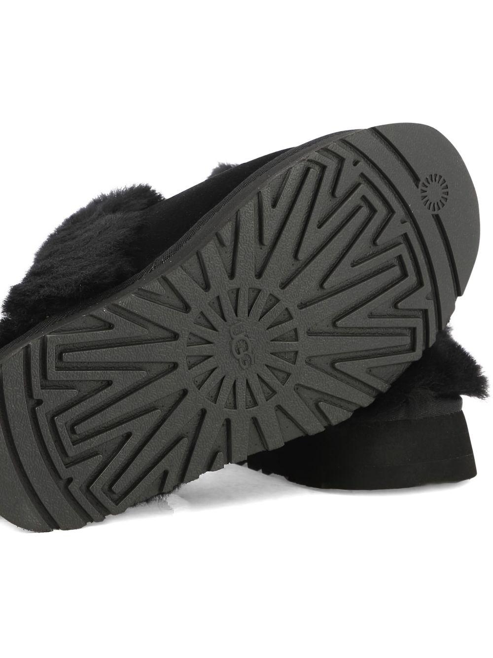 Slippers per bambina UGG Kids Disquette nero con finitura in pelliccia sintetica - Rubino Kids