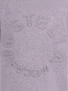 T-shirt per bambina Stella McCartney Kids grigia con logo goffrato sul davanti - Rubino Kids