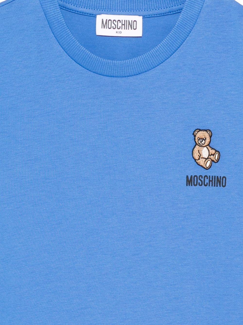 T-shirt per bambini Moschino Kids azzurro con applicazione Teddy Bear - Rubino Kids