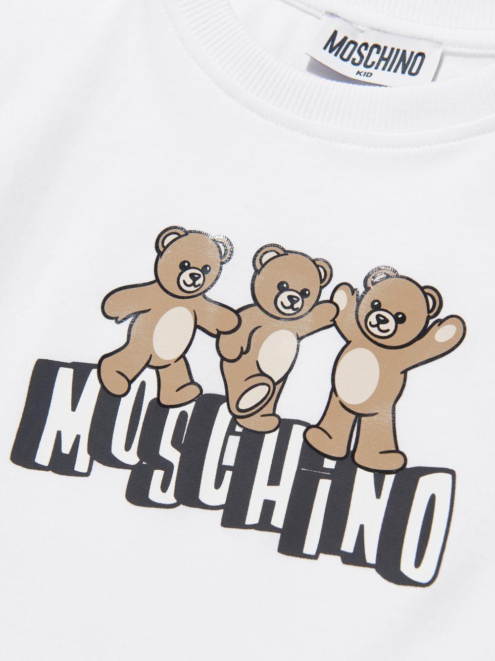 T-shirt per bambini Moschino Kids bianca con stampa grafica tre Teddy Bear - Rubino Kids