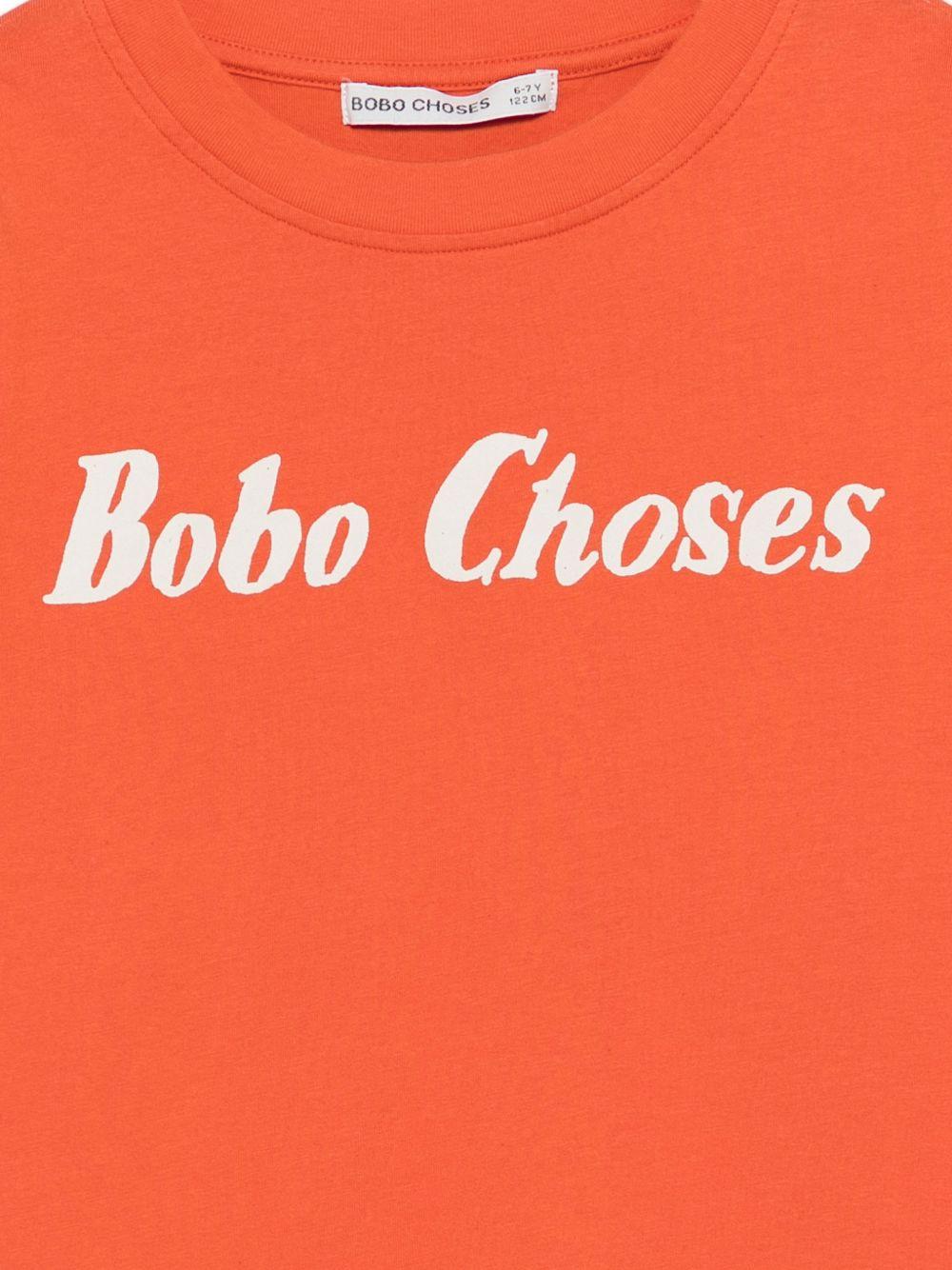 T-shirt per bambino Bobo Choses arancione con scritta logo sul davanti - Rubino Kids