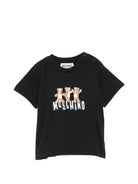 T-shirt per neonati Moschino Kids nera con stampa grafica tre Teddy Bear - Rubino Kids