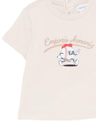 T-shirt per neonato Emporio Armani Kids beige con stampa pallina da tennis - Rubino Kids