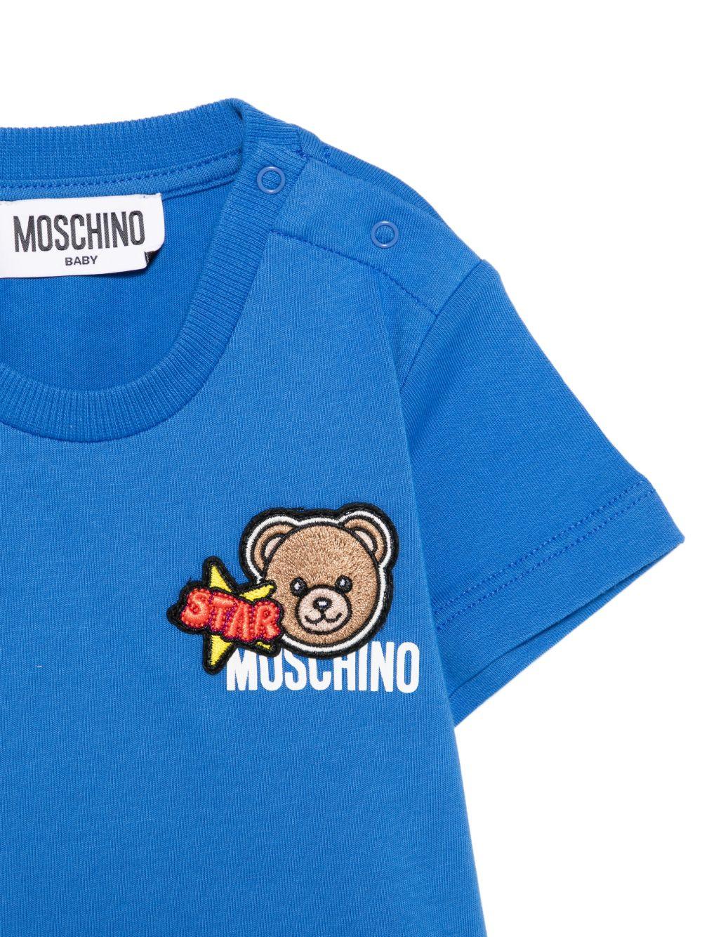T-shirt per neonato Moschino Kids azzurra con dettagli in rilievo - Rubino Kids