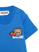 T-shirt per neonato Moschino Kids azzurra con dettagli in rilievo - Rubino Kids
