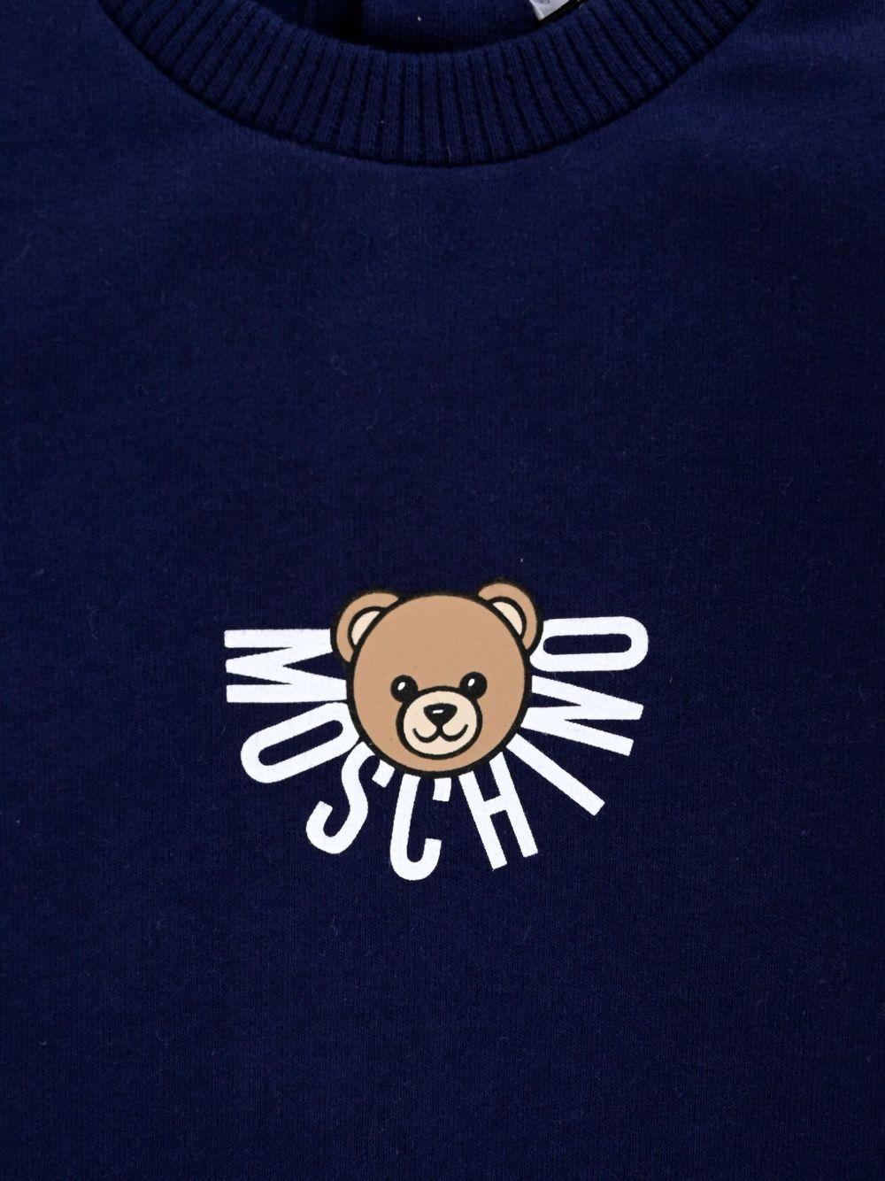 Tutina per neonati Moschino Kids blu in cotone con stampa teddy - Rubino Kids